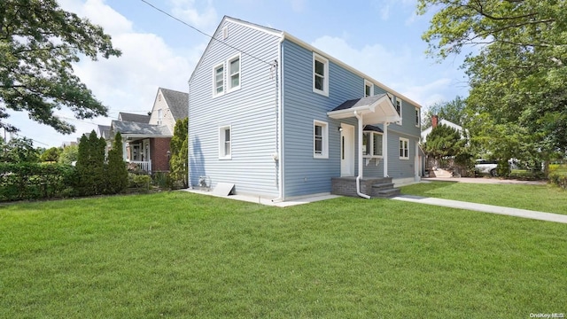 view of home's exterior with a yard