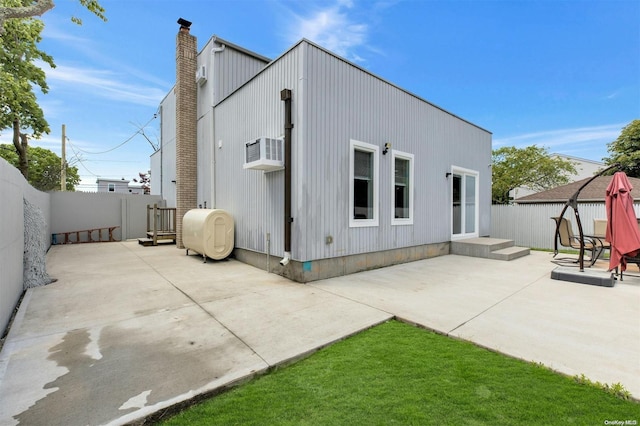 rear view of house featuring a patio