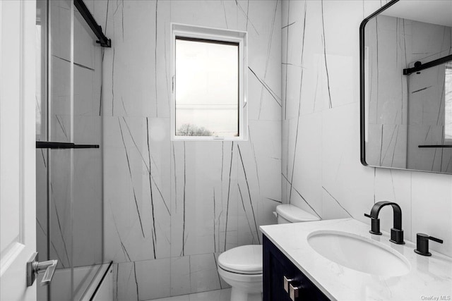 bathroom featuring a wealth of natural light, tile walls, and walk in shower