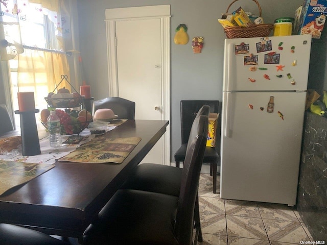 dining room featuring tile patterned flooring