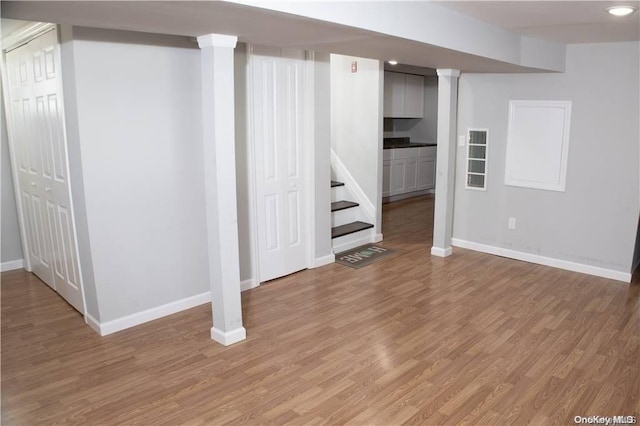 basement featuring wood-type flooring