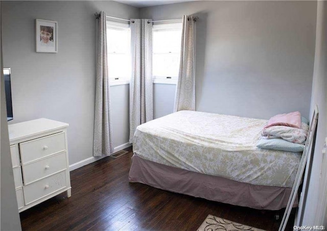 bedroom featuring dark hardwood / wood-style flooring