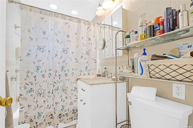 full bathroom with vanity, toilet, and shower / bath combo with shower curtain