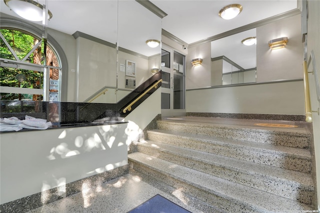 stairs featuring ornamental molding