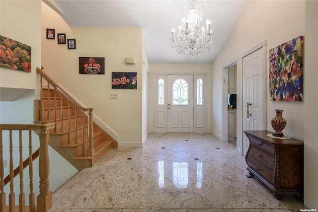 foyer entrance featuring lofted ceiling and a notable chandelier