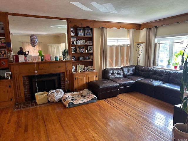 living room with hardwood / wood-style floors, a fireplace, and a textured ceiling