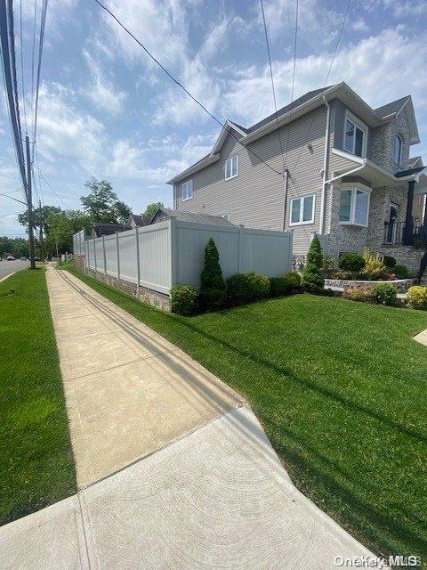 view of home's exterior with a yard