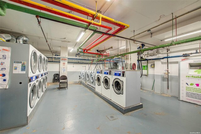 basement with stacked washer / drying machine and washing machine and clothes dryer