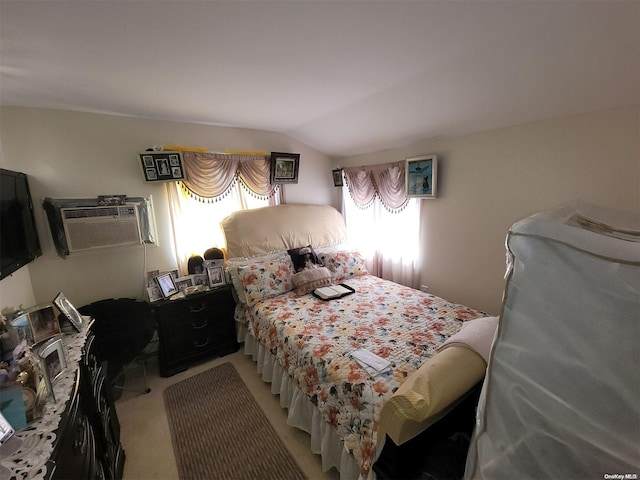 carpeted bedroom with lofted ceiling