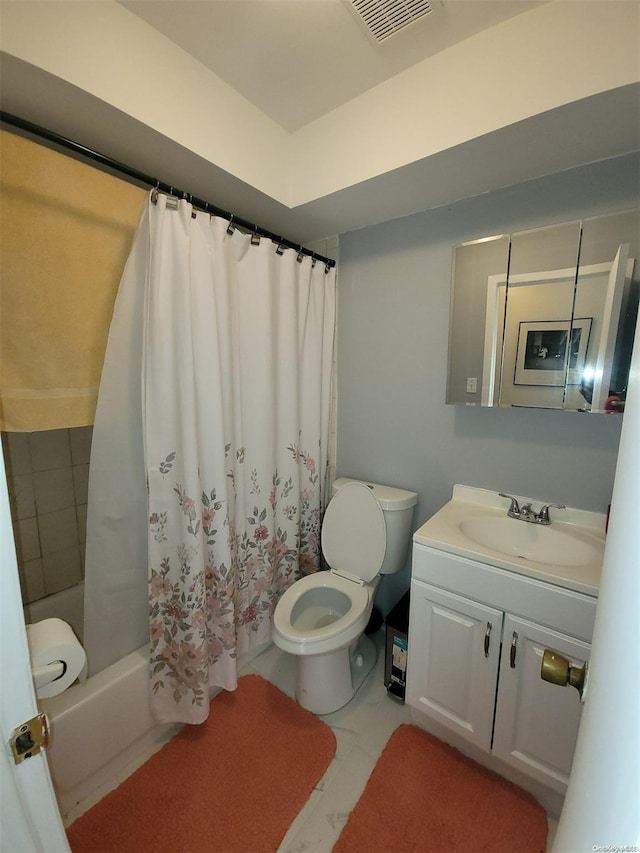 full bathroom featuring vanity, shower / bath combination with curtain, and toilet