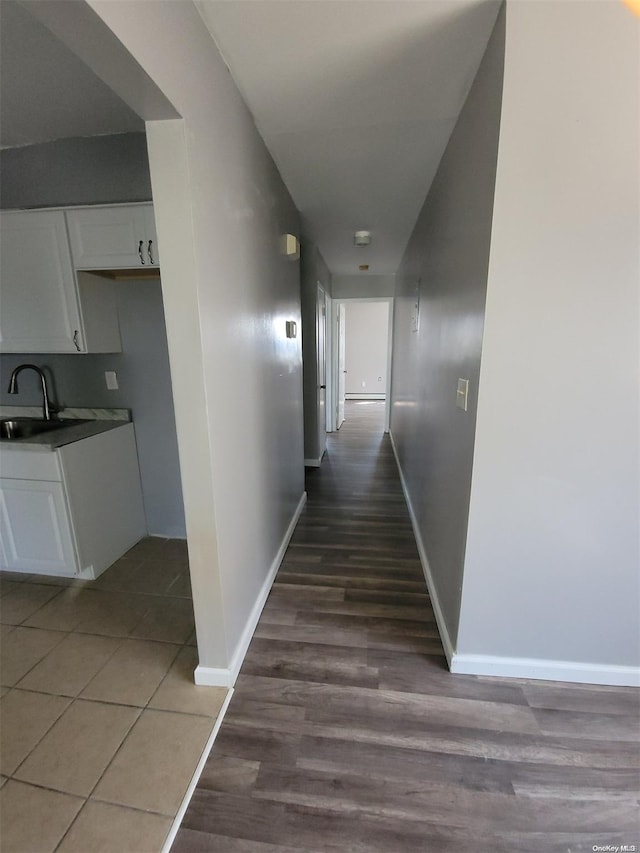 hallway featuring dark hardwood / wood-style flooring and sink