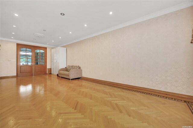 unfurnished room featuring ornamental molding and light parquet flooring