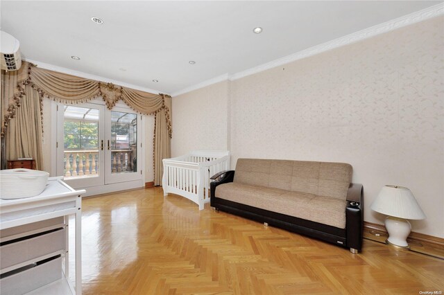 bedroom with a wall mounted air conditioner, parquet flooring, crown molding, and french doors