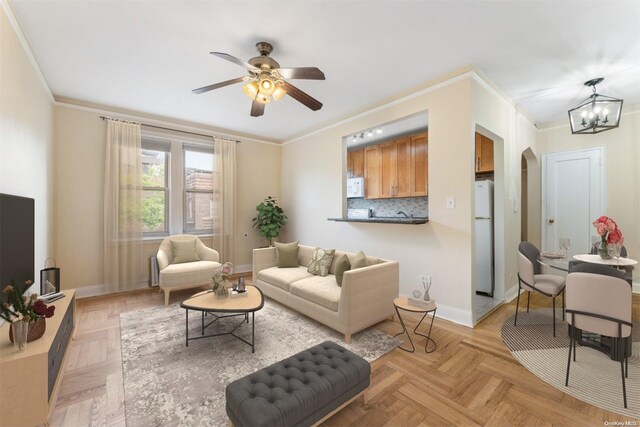 48-17 42nd St Unit 7B, Woodside, NY 11377 - living room with ceiling fan with notable chandelier, ornamental molding, and light parquet floors