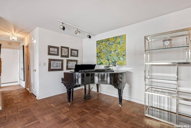 misc room featuring dark parquet flooring