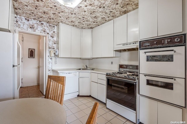 kitchen featuring white cabinetry, white appliances, sink, and extractor fan