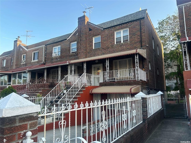 view of property featuring covered porch