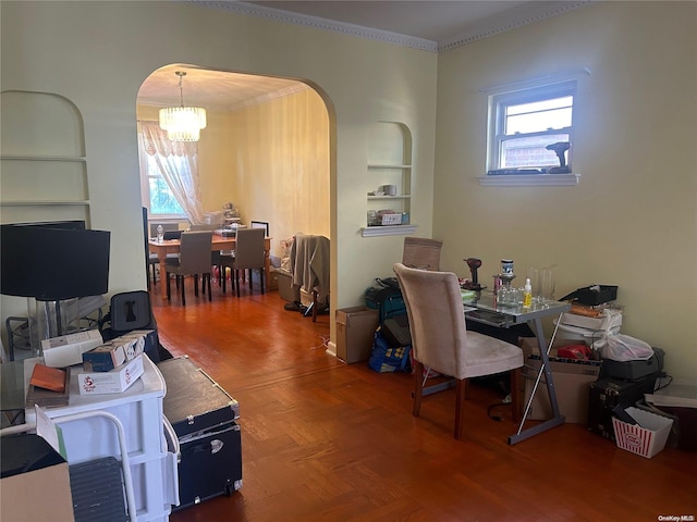 office area featuring parquet floors, an inviting chandelier, plenty of natural light, and crown molding