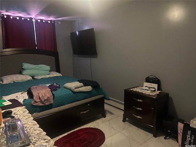 bedroom featuring a baseboard radiator