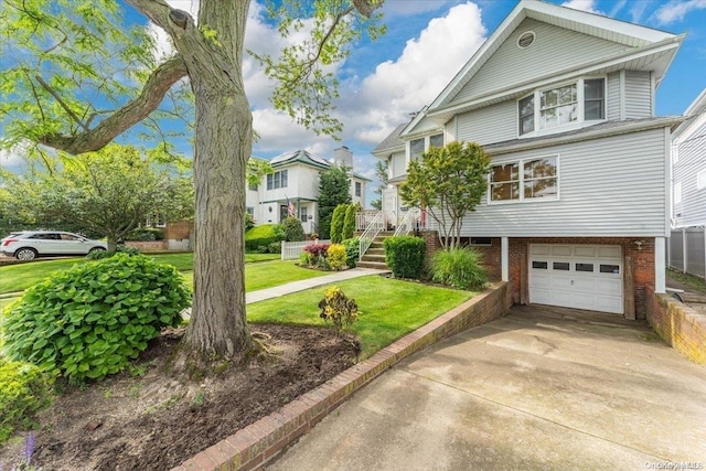 view of front of property with a garage and a front yard