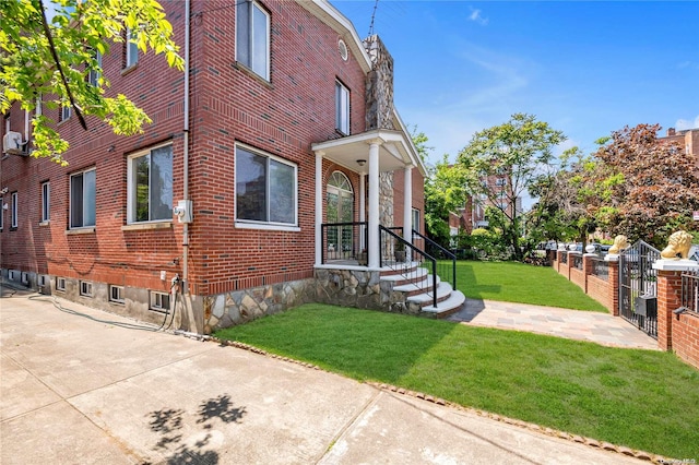 view of property exterior with a yard