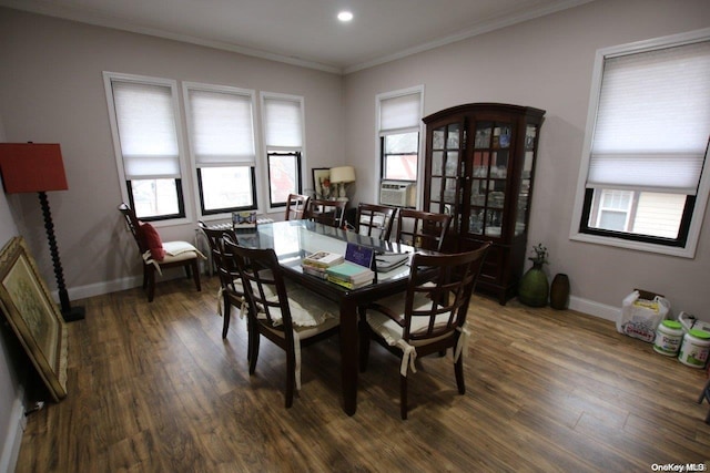 dining room with crown molding and dark hardwood / wood-style floors