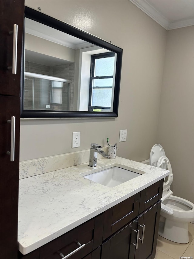 bathroom with tile patterned floors, toilet, a shower with door, vanity, and ornamental molding