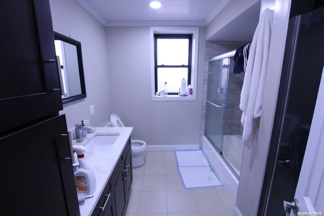 bathroom featuring tile patterned floors, toilet, vanity, and ornamental molding