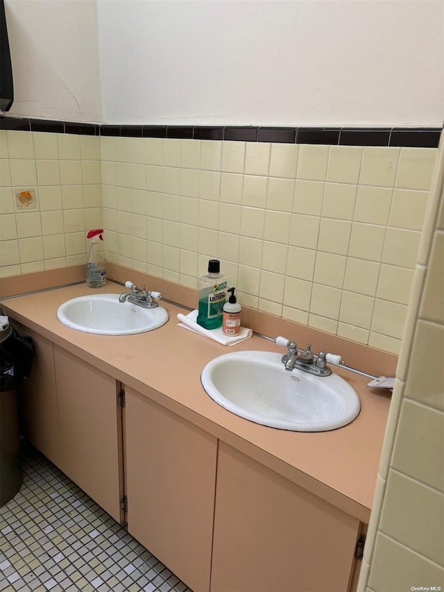 bathroom featuring tile patterned floors, vanity, and tile walls