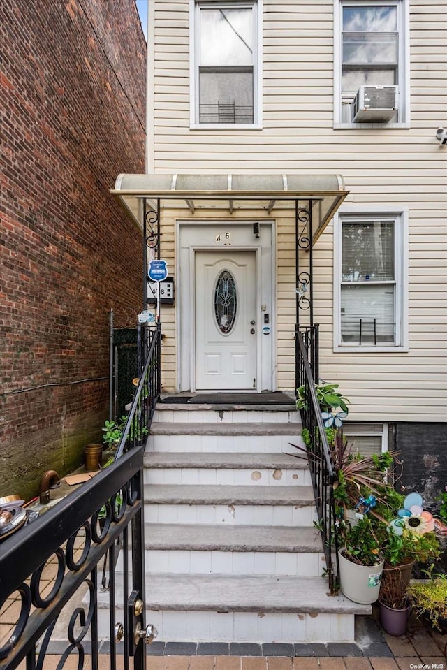 property entrance featuring cooling unit