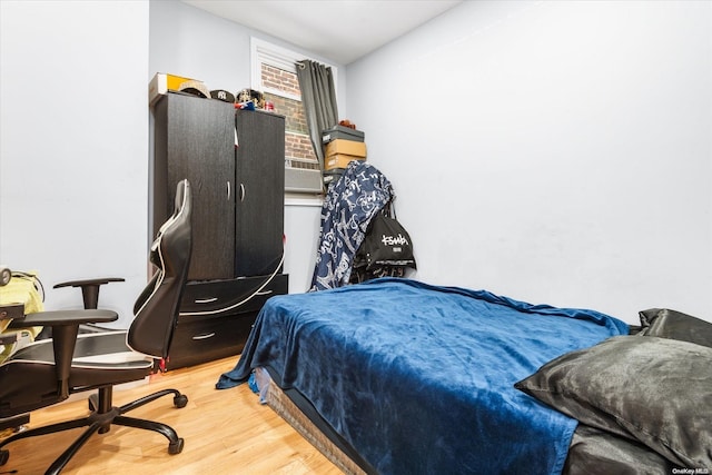 bedroom with wood-type flooring