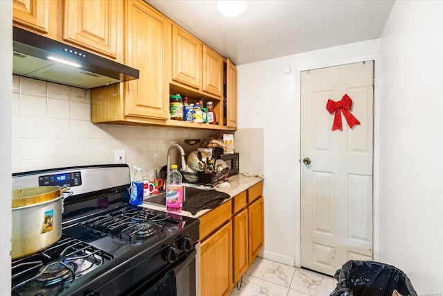 kitchen featuring decorative backsplash, light stone counters, and stainless steel range with gas stovetop