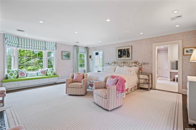 bedroom featuring crown molding and light carpet