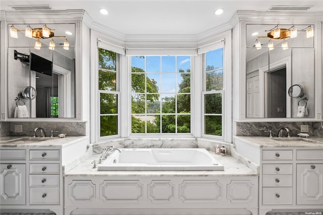 200 Cleft Rd, Mill Neck, NY 11765 - bathroom featuring a garden tub, vanity, backsplash, crown molding, and recessed lighting