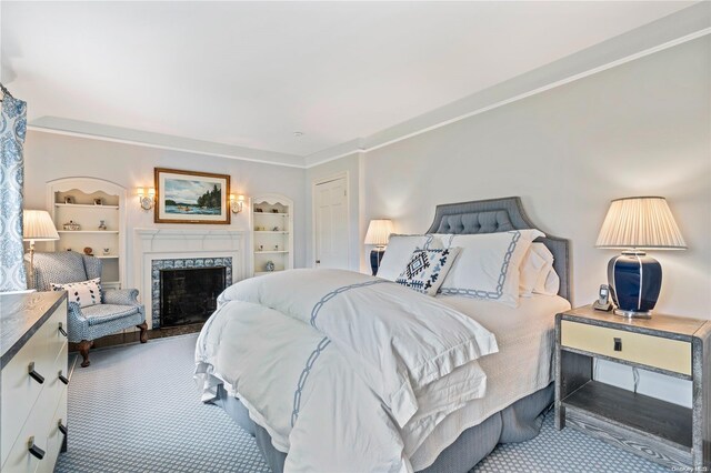 200 Cleft Rd, Mill Neck, NY 11765 - carpeted bedroom featuring a fireplace and ornamental molding