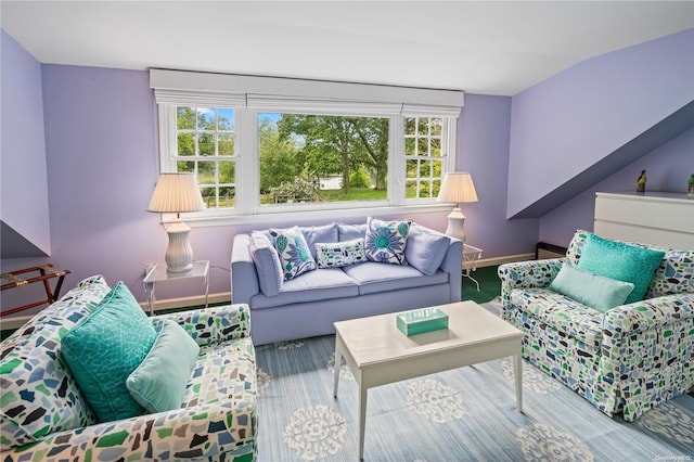 living room featuring carpet and lofted ceiling