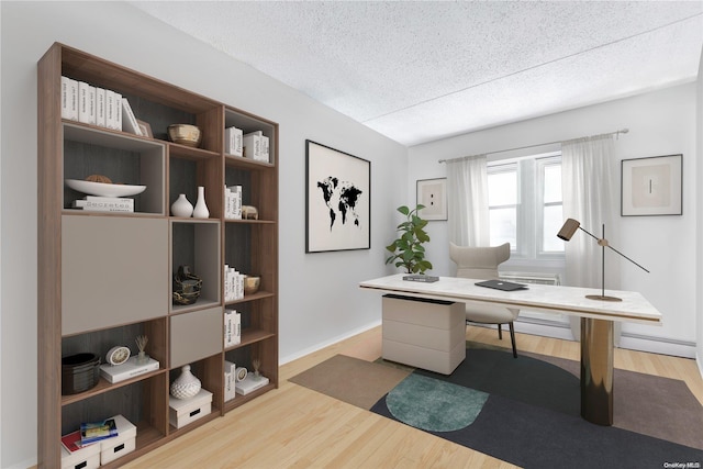 office area with hardwood / wood-style floors and a textured ceiling