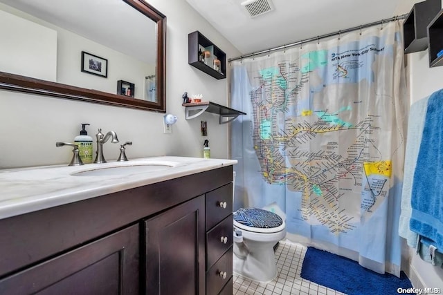 full bathroom with toilet, shower / tub combo, vanity, and tile patterned floors