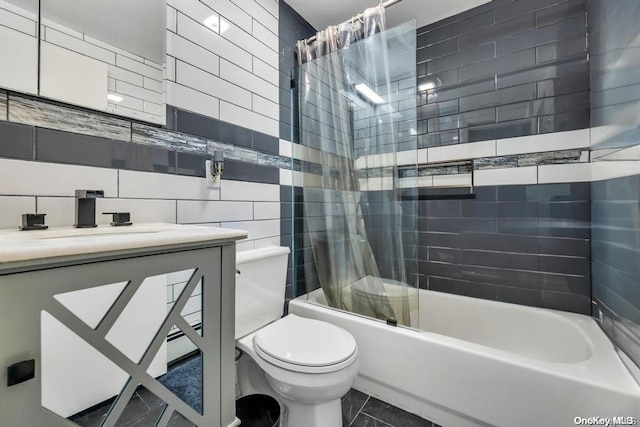 full bathroom featuring tasteful backsplash, vanity, shower / tub combo with curtain, tile walls, and toilet