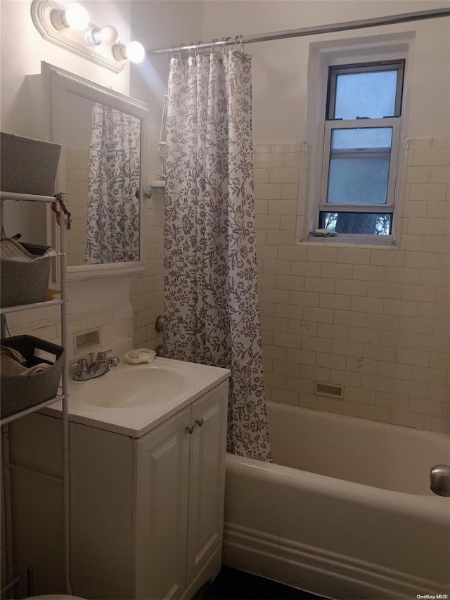 bathroom with vanity and shower / bath combo with shower curtain