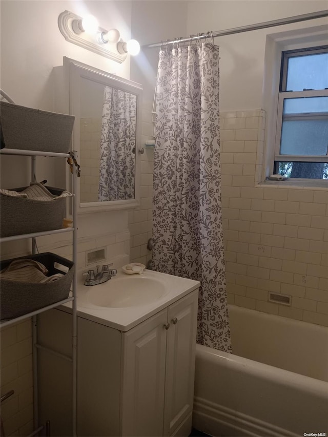 bathroom with vanity and shower / tub combo with curtain