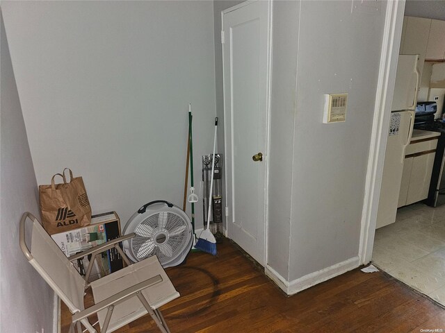 corridor with dark wood-type flooring