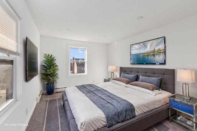 bedroom featuring carpet floors and a baseboard radiator