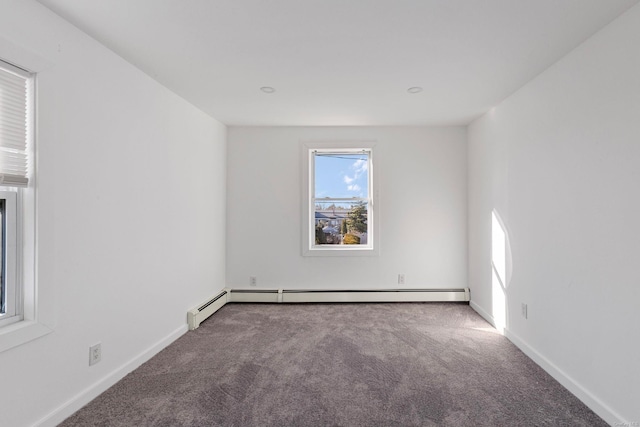 unfurnished room featuring carpet and a baseboard radiator