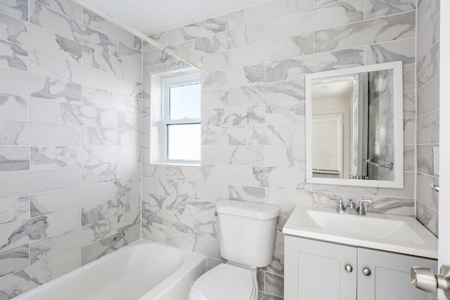 full bathroom featuring vanity, toilet, washtub / shower combination, and tile walls