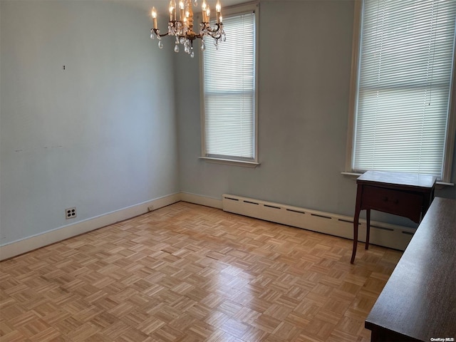 unfurnished dining area with light parquet flooring, a baseboard radiator, and a chandelier