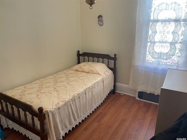 bedroom featuring hardwood / wood-style flooring