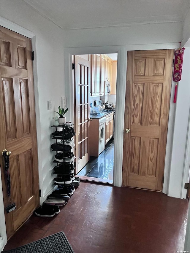 interior space featuring dark hardwood / wood-style flooring and washer / clothes dryer