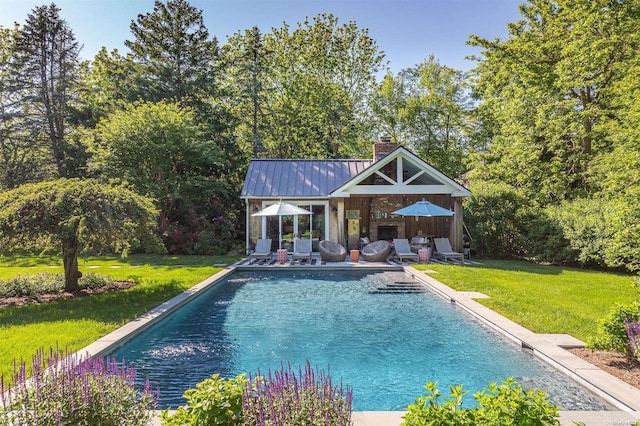 view of pool featuring a yard and a patio