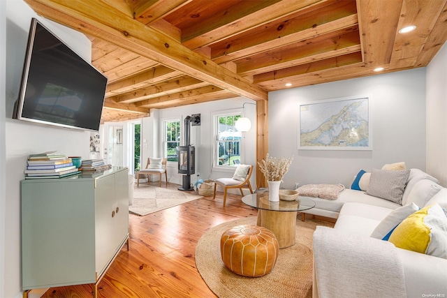 living room featuring beam ceiling, wooden ceiling, and light wood-type flooring